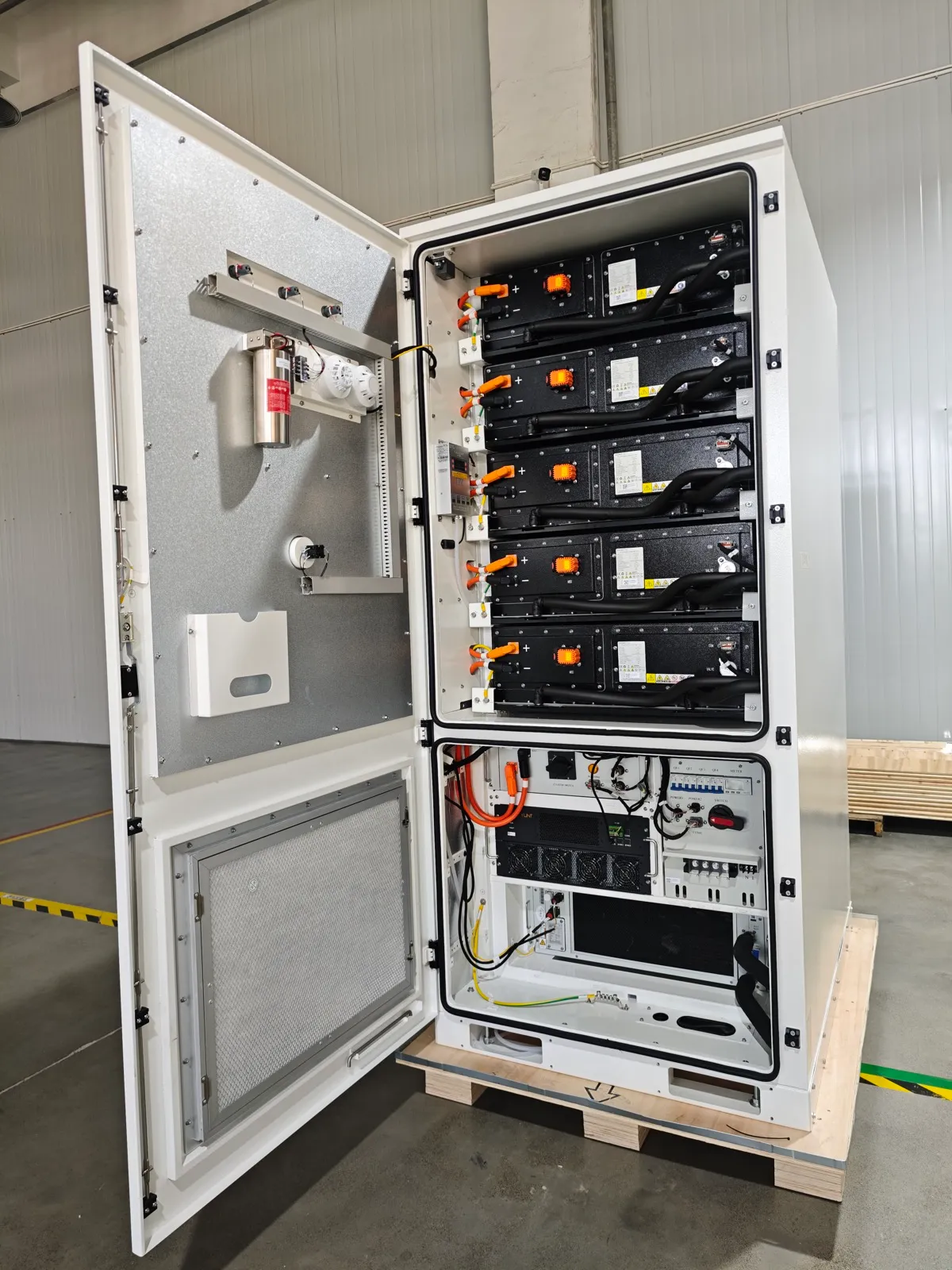 Inside a SKTESS cabinet — battery modules and inverter
